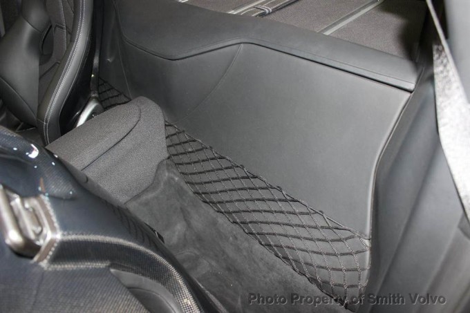The Ferrari F12berlinetta transmission is under the leather package tray. 