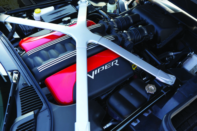 Under the hood of the 2016 Dodge Viper SRT models is the all-aluminum, mid-front 8.4-liter V-10 engine that delivers 645 horsepower and 600 lb.-ft. of torque – the most torque of any naturally aspirated sports car engine in the world. The aluminum “X” brace ties the suspension pickup points to the magnesium cowl super casting and contributes to improved torsional rigidity and stiffness.