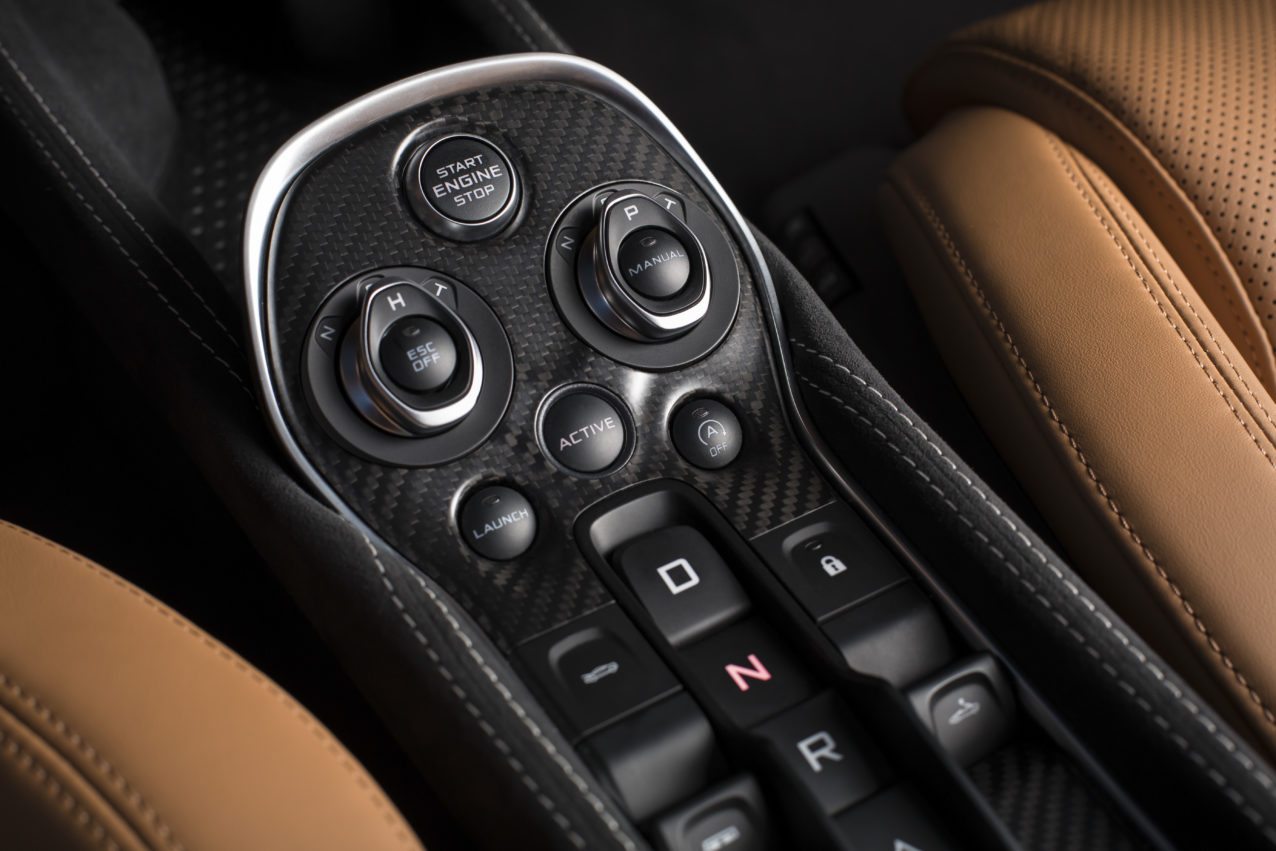The controls for stability and shifting on the McLaren 570S Spider. 