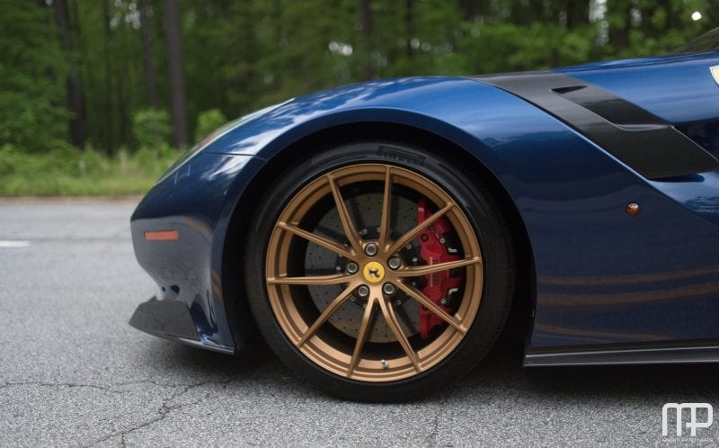 The Ferrari F12tdf brakes are larger than most wheels. 