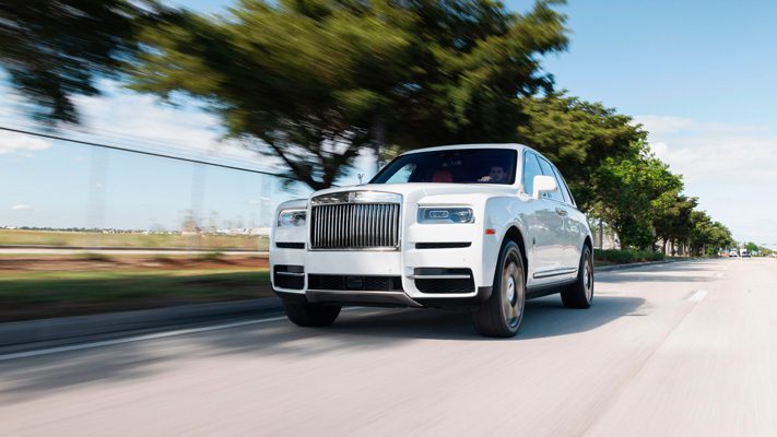 white on orange rolls royce cullinan for rent in miami rolling view mph club